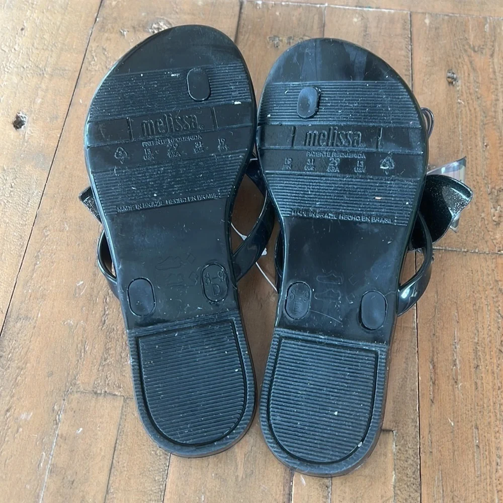 Mini Melissa Mel harmonic black bow flip flop sandals